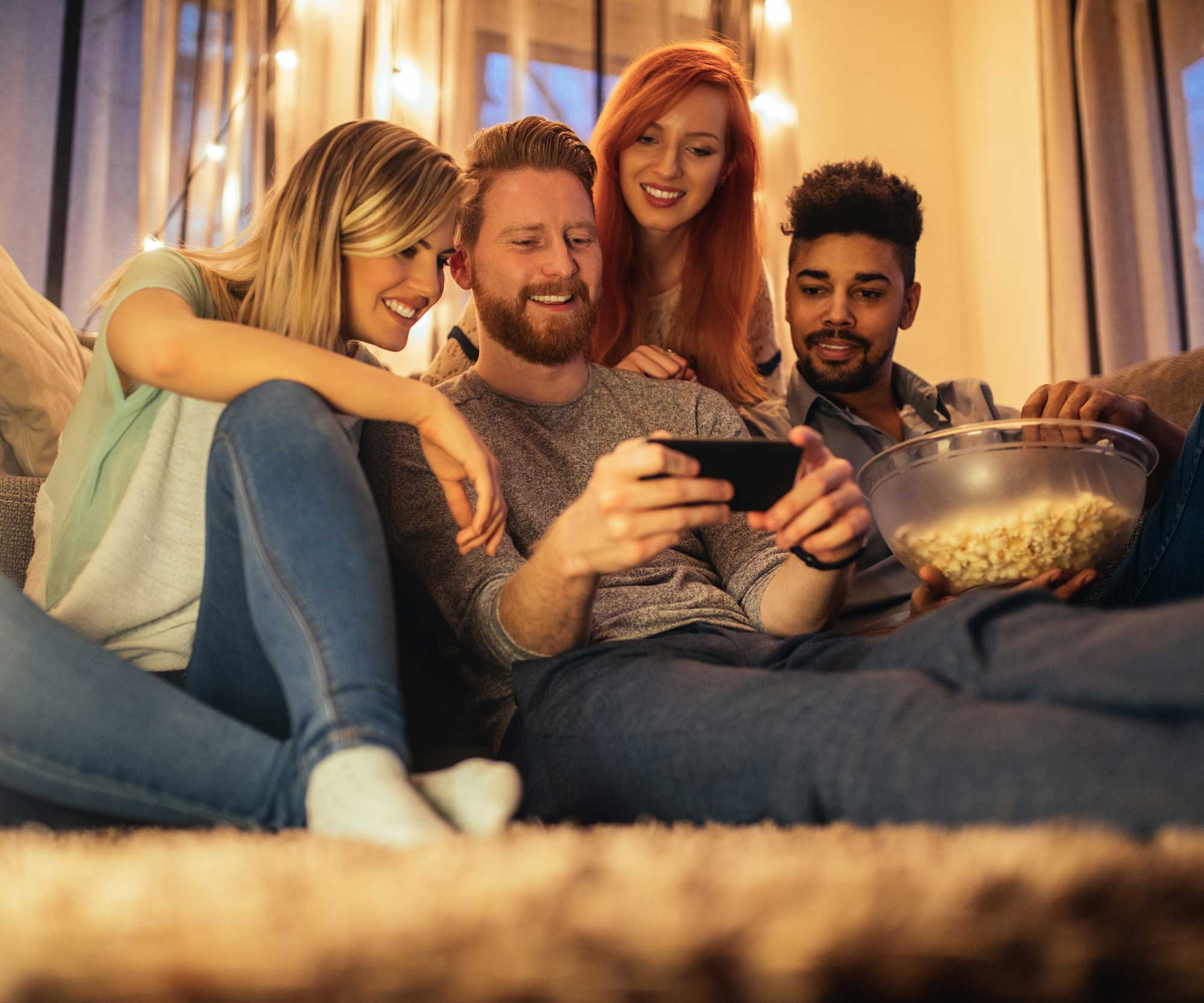 group of friends looking at a phone